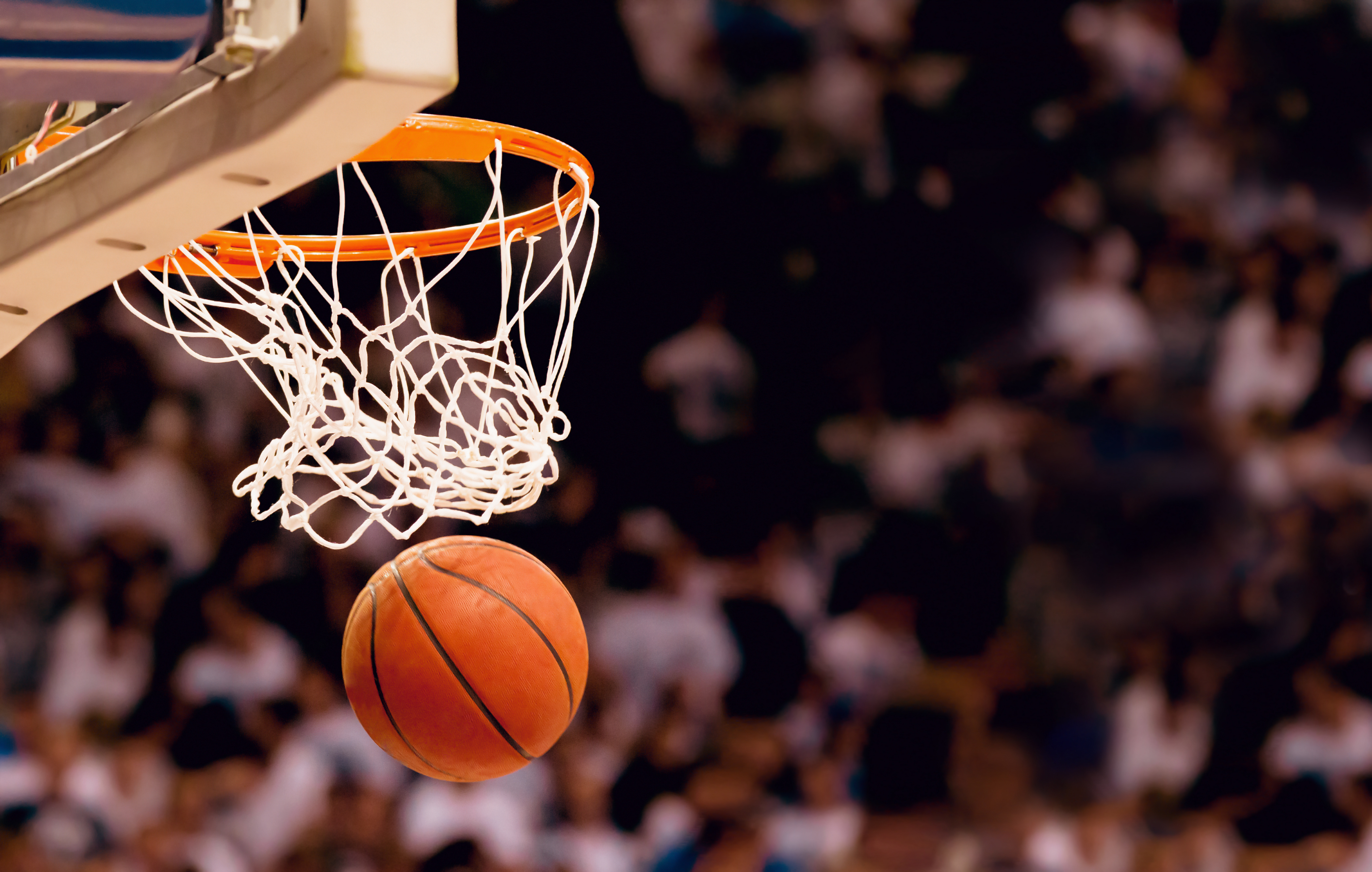 A basketball going through a hoop