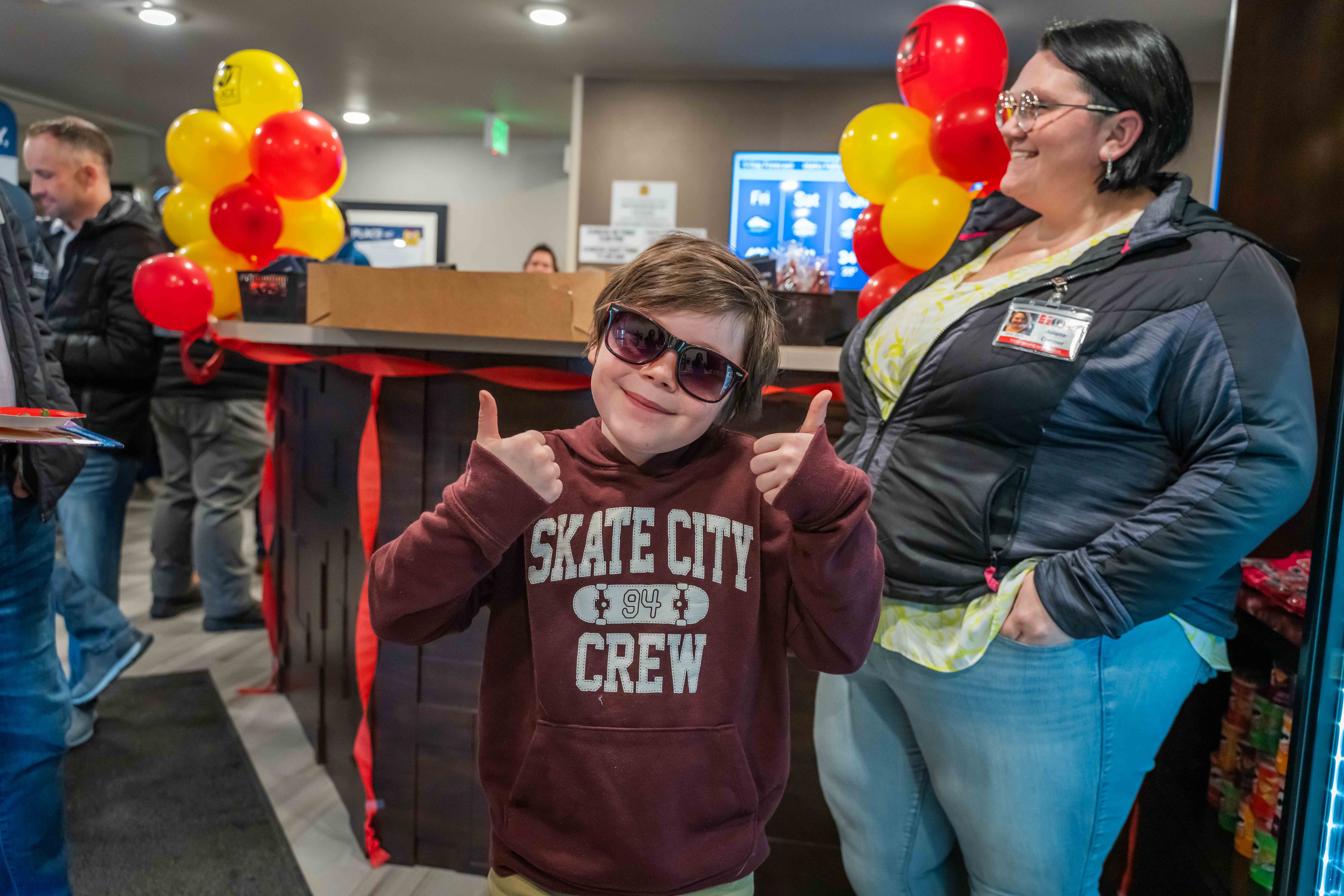 Child posing with sunglasses on in the lobby of a My Place Hotel