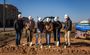 Pictured are six professionals posing in their My Place hard hats with shovels in their hands.