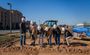 Pictured are six professionals posing in their My Place hard hats shoveling the dirt for the groundbreaking.