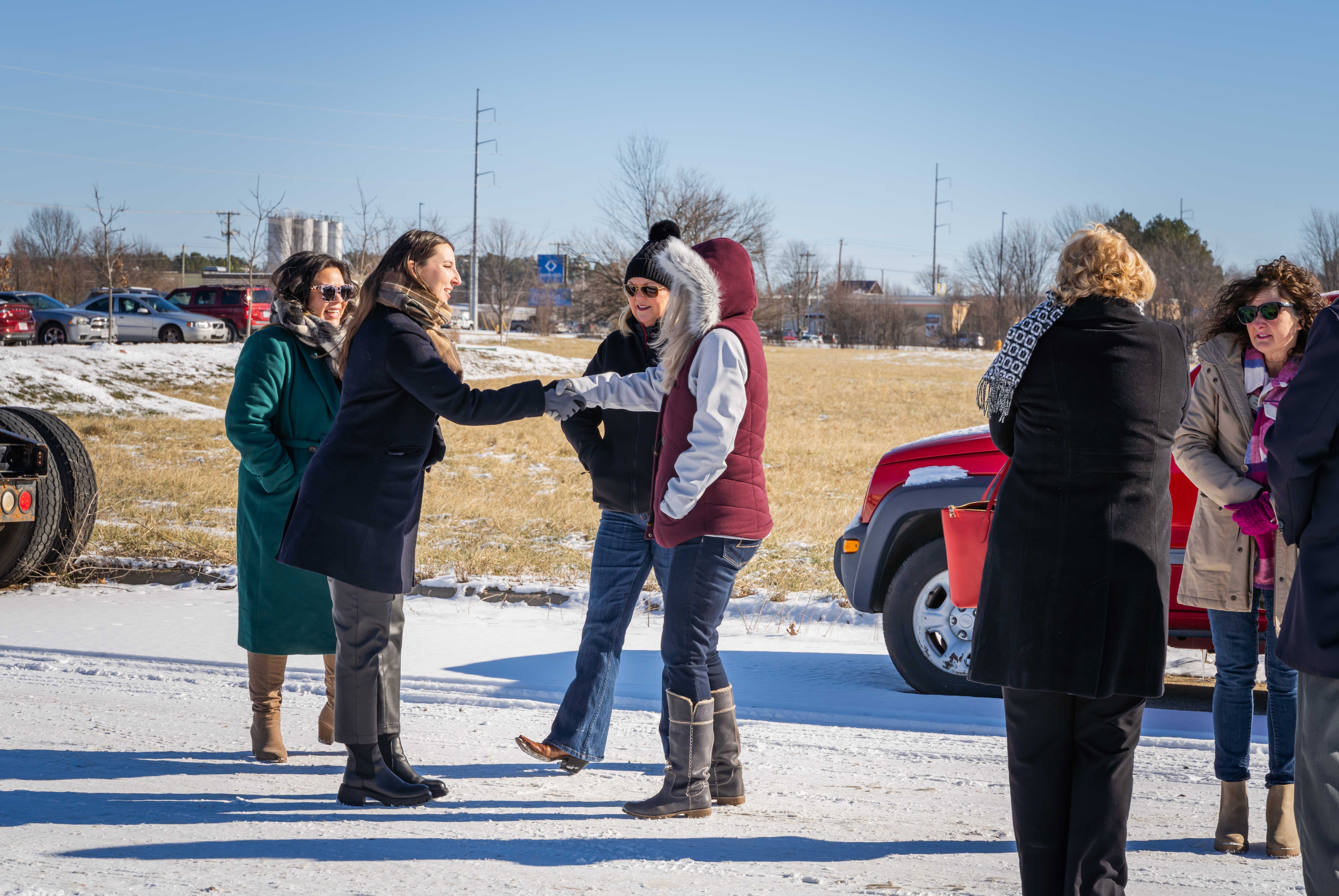 group of women meeting and shaking hands