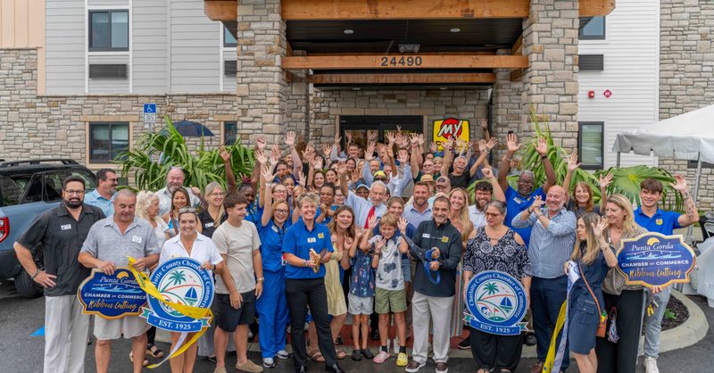 Group ribbon cutting.
