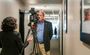 A reporter conducts a video interview of a man in a hallway inside the brand new hotel in Nampa, Idaho.