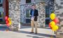 A man addresses an off-camera crowd in front of the brand new hotel in Nampa, Idaho.