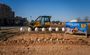 Pictured are the My Place hard hats siting on shovels in the dirt at the groundbreaking in Jonesboro.