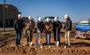 Pictured are six professionals posing in their My Place hard hats with shovels in their hands.