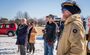 a group of individuals looking on during a groundbreaking ceremony