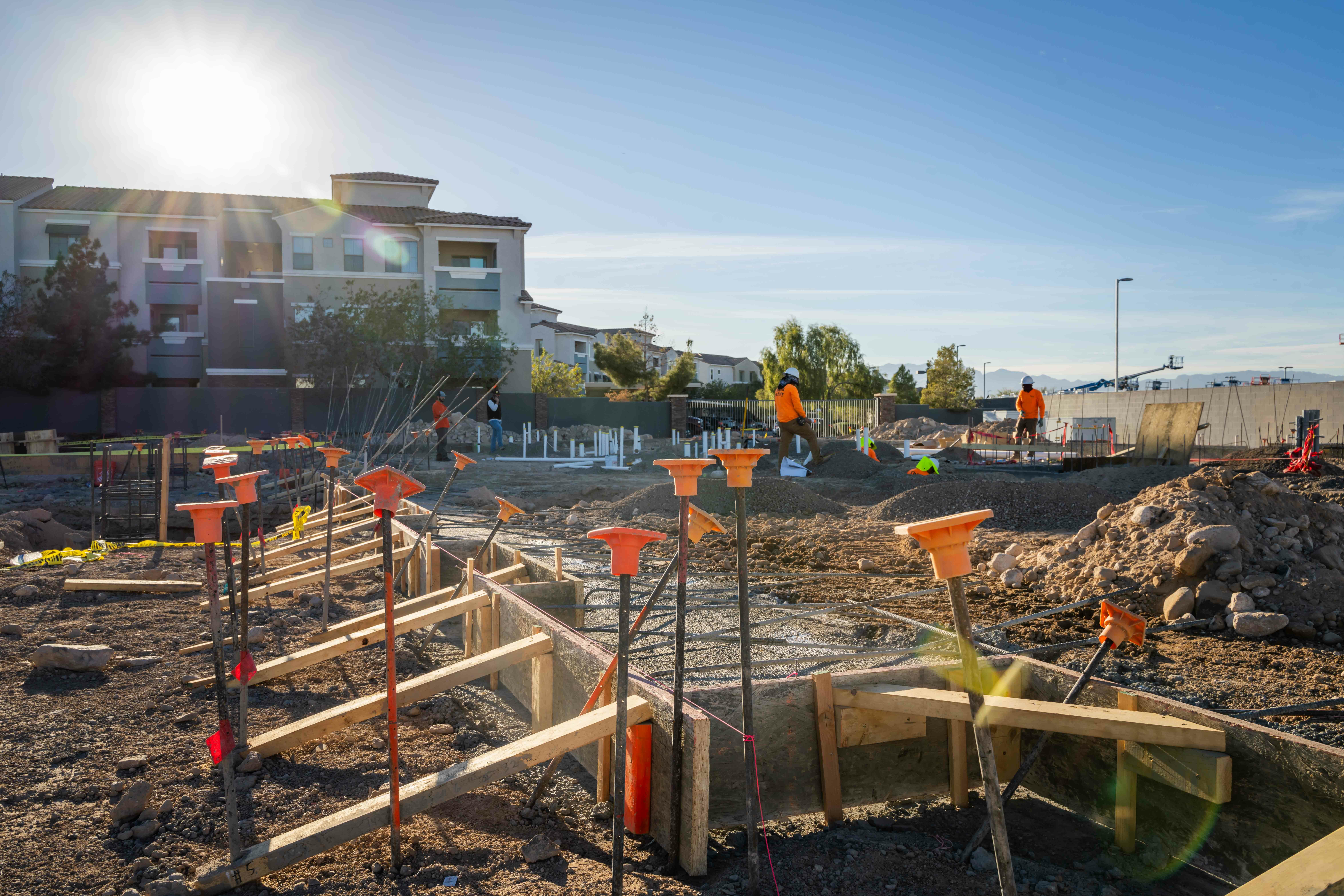 Construction site with base layer of concrete poured at new hotel site.