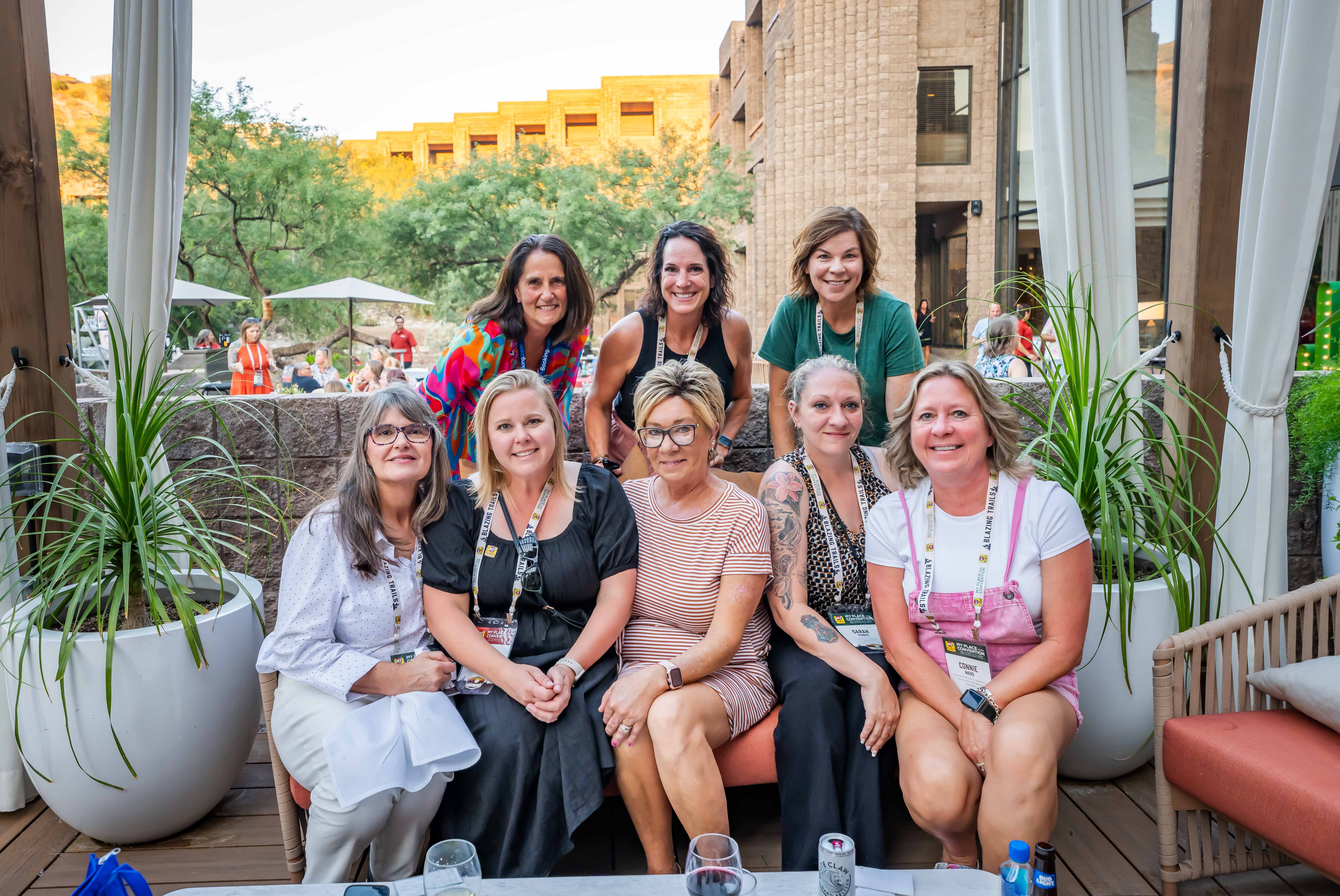 A group of women posing for a photo at a networking event