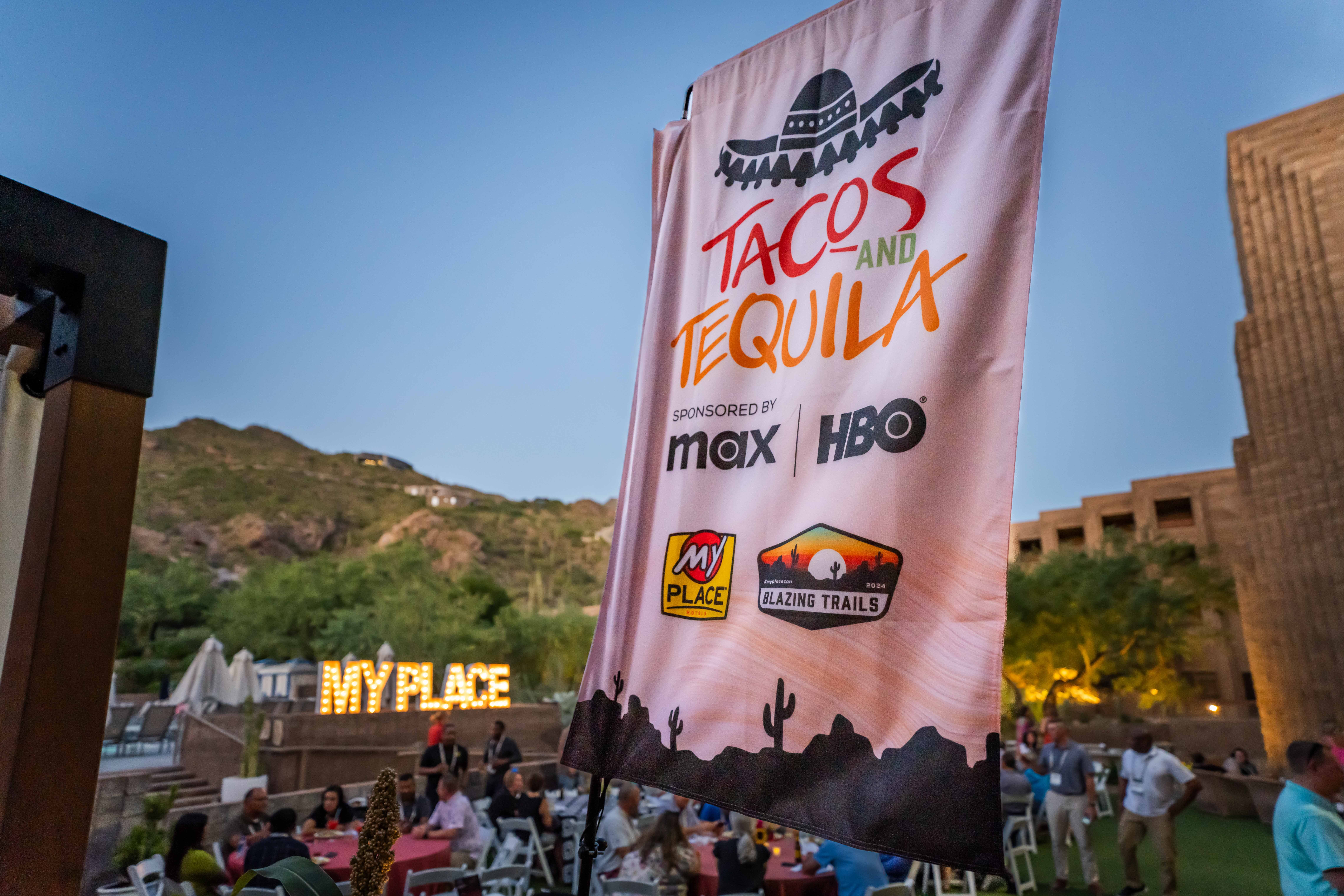 A flag depicting a networking event at a hospitality conference