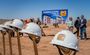 My Place construction hats sitting on top of shovels at the groundbreaking of Mesa.