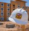 A hard hat with the My Place hotels logo is pictured in front of the structure of the hotel.