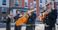 A group of four musicians are pictured playing instruments outside the new hotel.