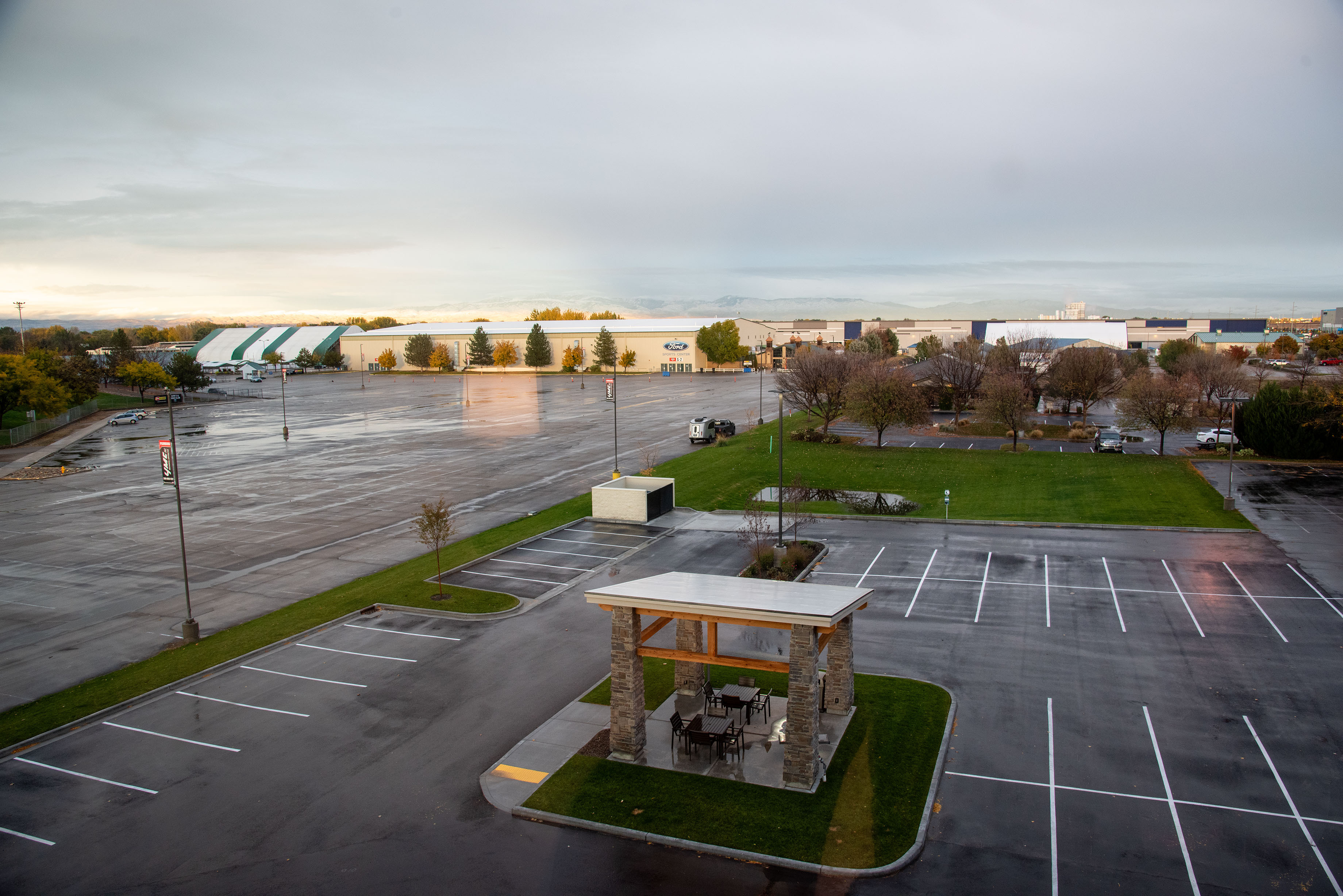 Elevated view of My Place parking lot showing grilling pavilion and nearby businesses.