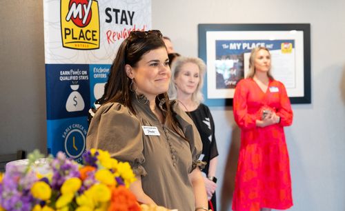 Guests are pictured listening to speakers in the lobby of the new Pooler hotel.