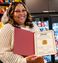 A professional is pictured holding the new certificate for the new Pooler Georgia hotel.