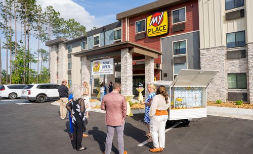 Guests are pictured in conversation outisde of the new hotel.