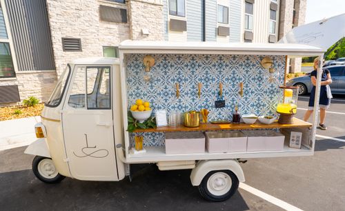 A picture of the beverage cart located outside of the hotel for the grand opening.
