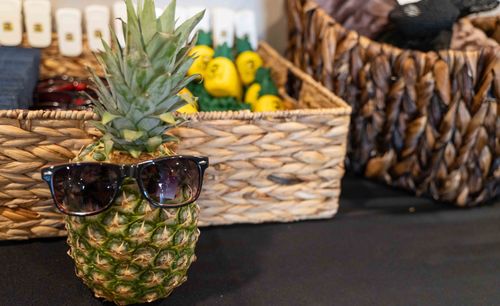 Pictured is the mascot of My Place hotels, Pineapple Pete, with his black sunglasses on.
