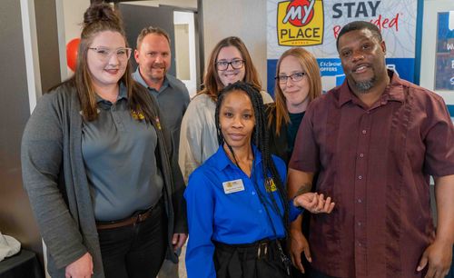 Guests of the grand opening are pictured posing in the lobby of the new hotel.