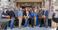 Pictured are professionals cutting the ribbon for the new hotel.