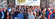 Group of people with hands in the air to celebrate a hotel grand opening
