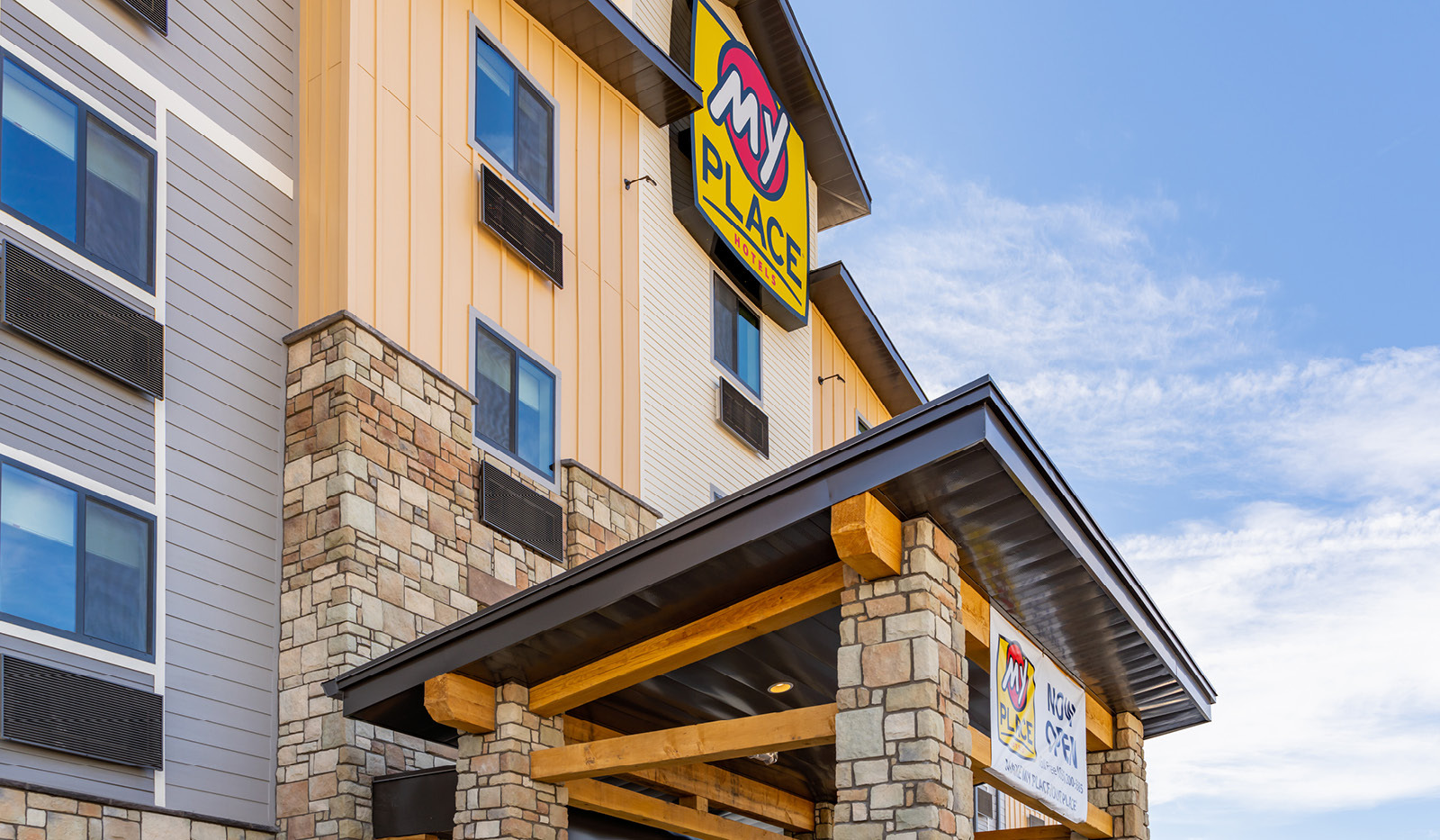 Exterior of My Place Hotel-Buckeye, AZ with logo on front of building.