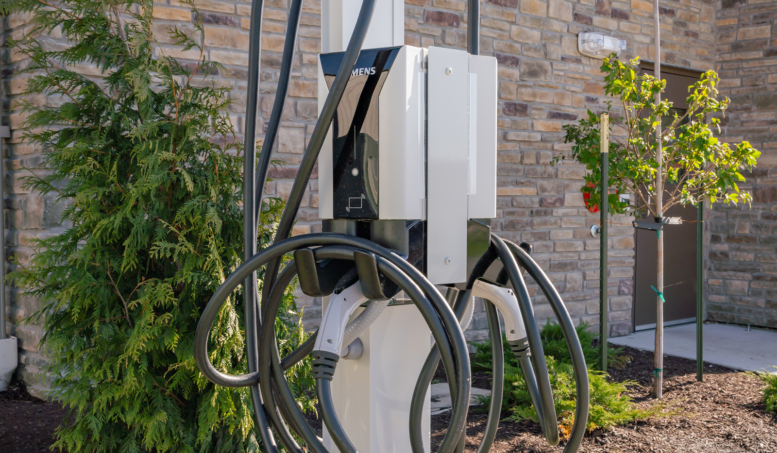 Exterior of My Place Hotel-East Moline, IL's electric car charging station.