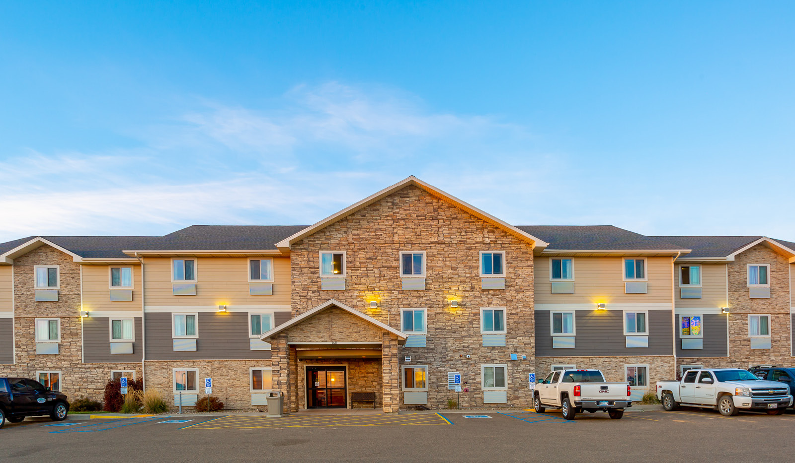 Wide exterior of My Place Hotel-Dickinson, ND.