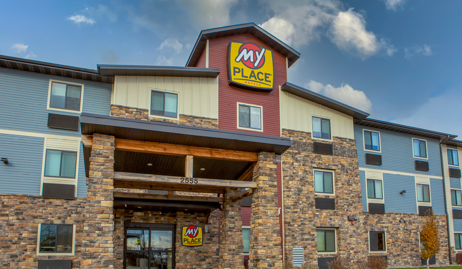 Exterior of My Place Hotel-Fargo, ND with hotel's automatic front door.