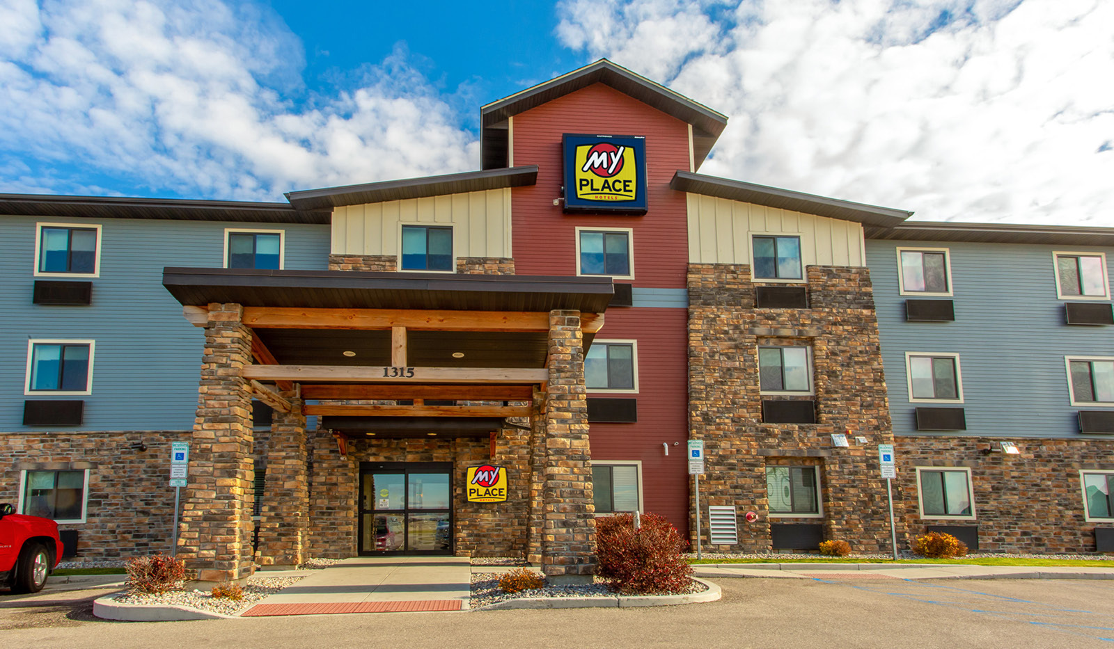Exterior of My Place Hotel-Grand Forks, ND showing main automatic doors.
