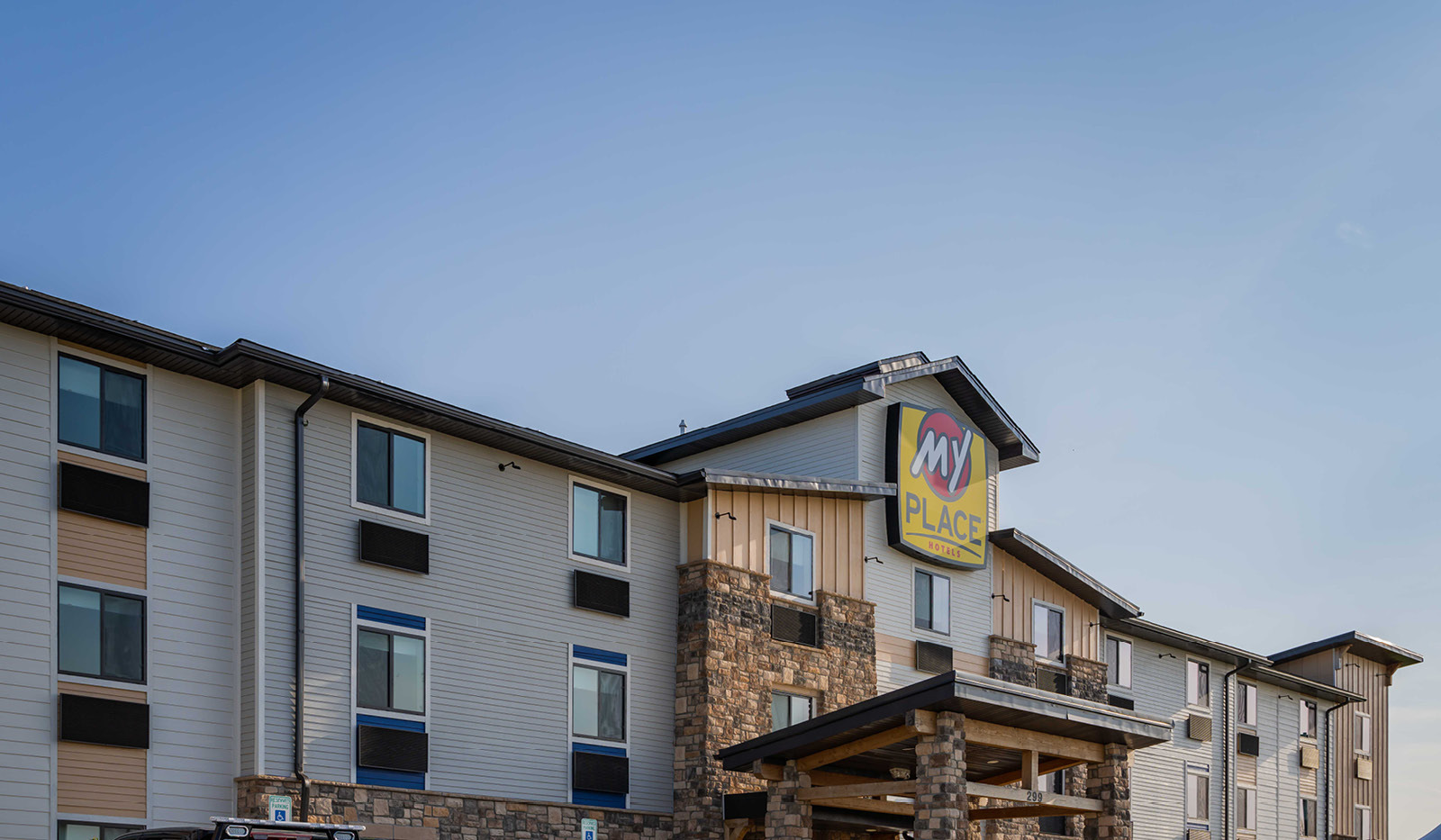 Top-half exterior of My Place Hotel-Marion, OH featuring logo sign.