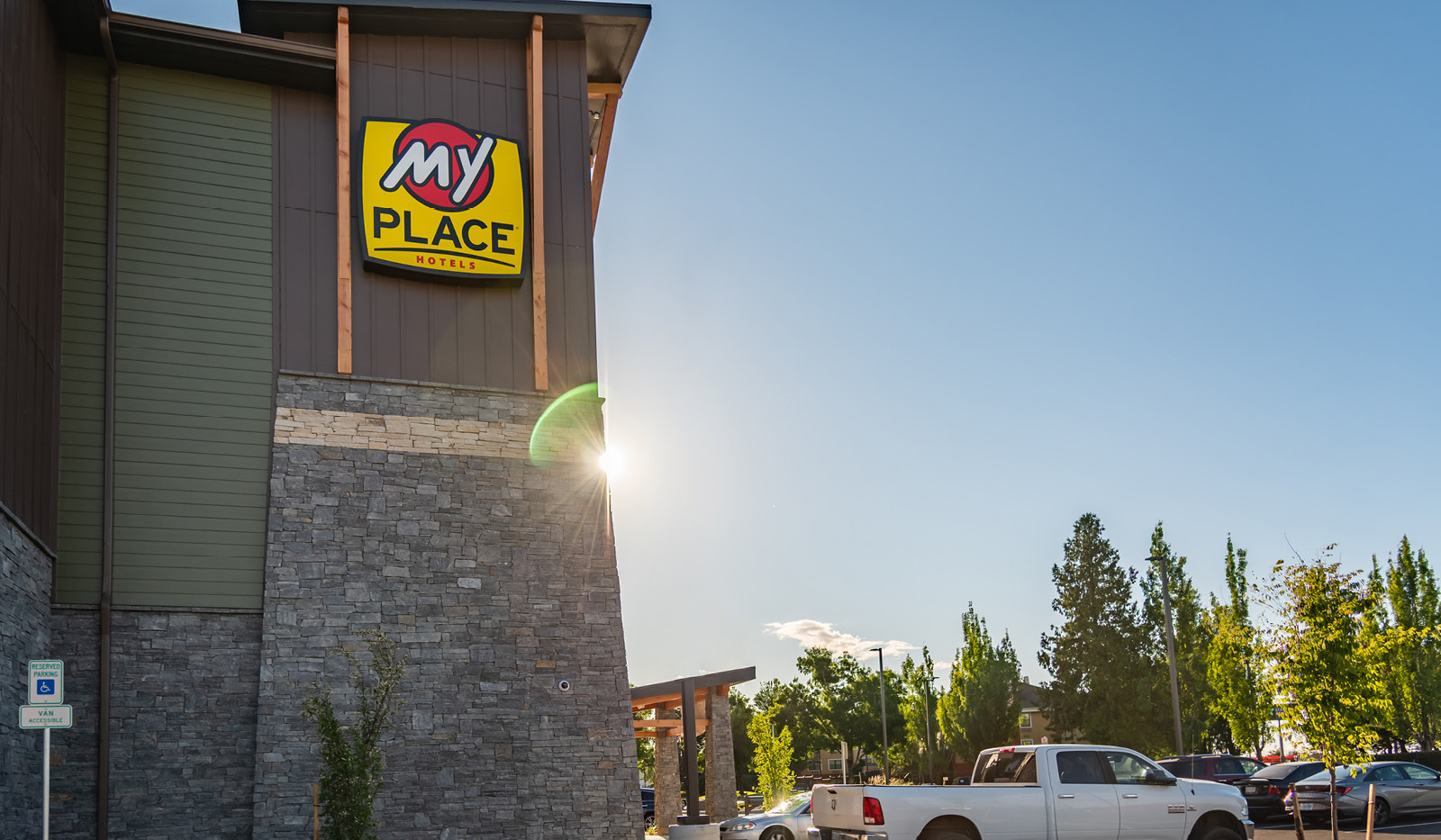 Exterior of side of My Place Hotel-Portland East, OR showing logo sign.