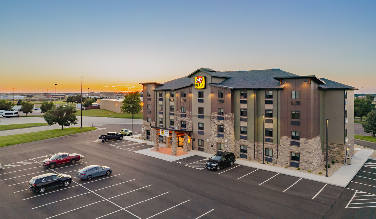 Front view of property exterior and parking lot.