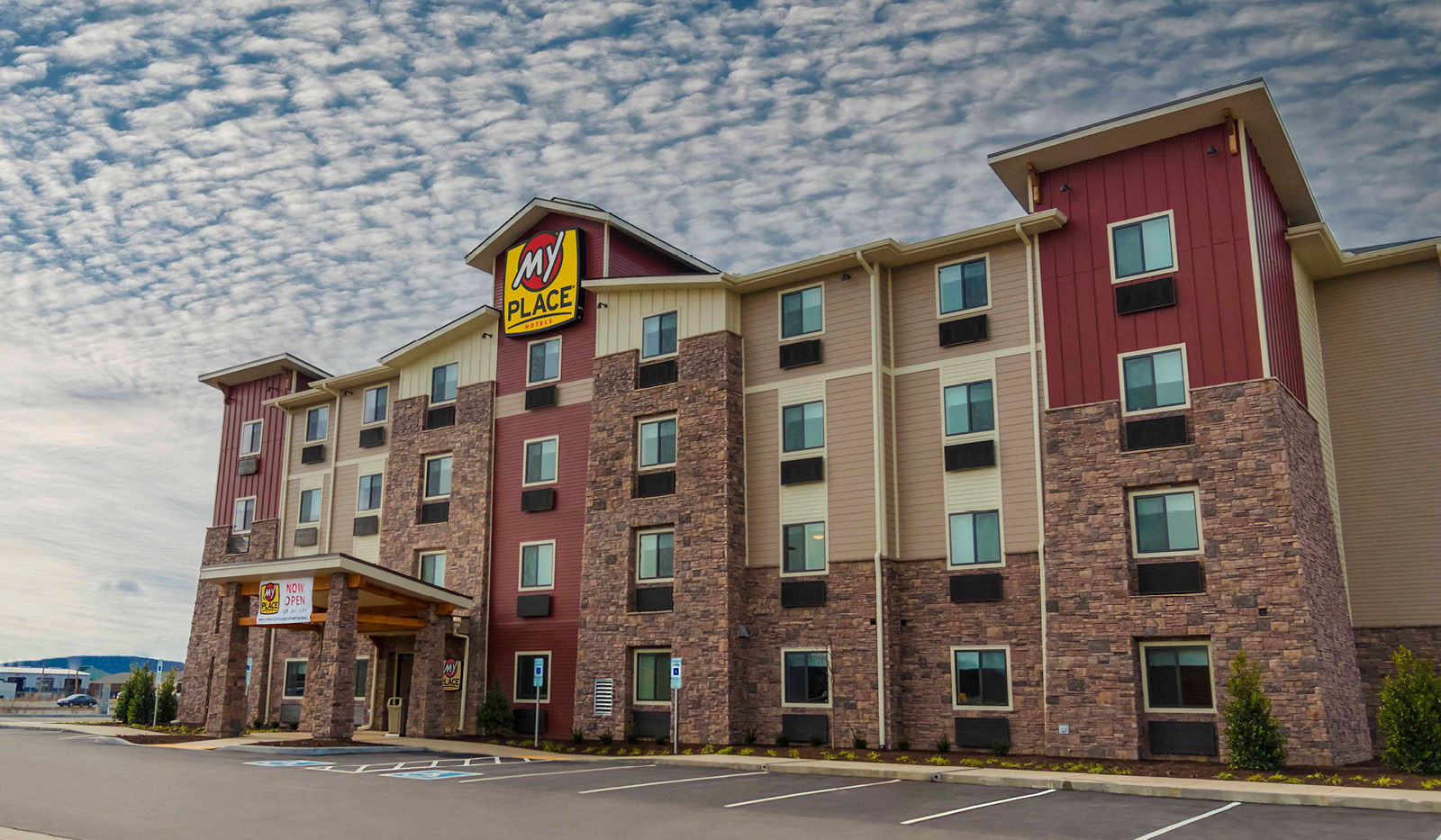 Exterior of My Place Hotel-Lebanon, TN under a partly cloudy sky.