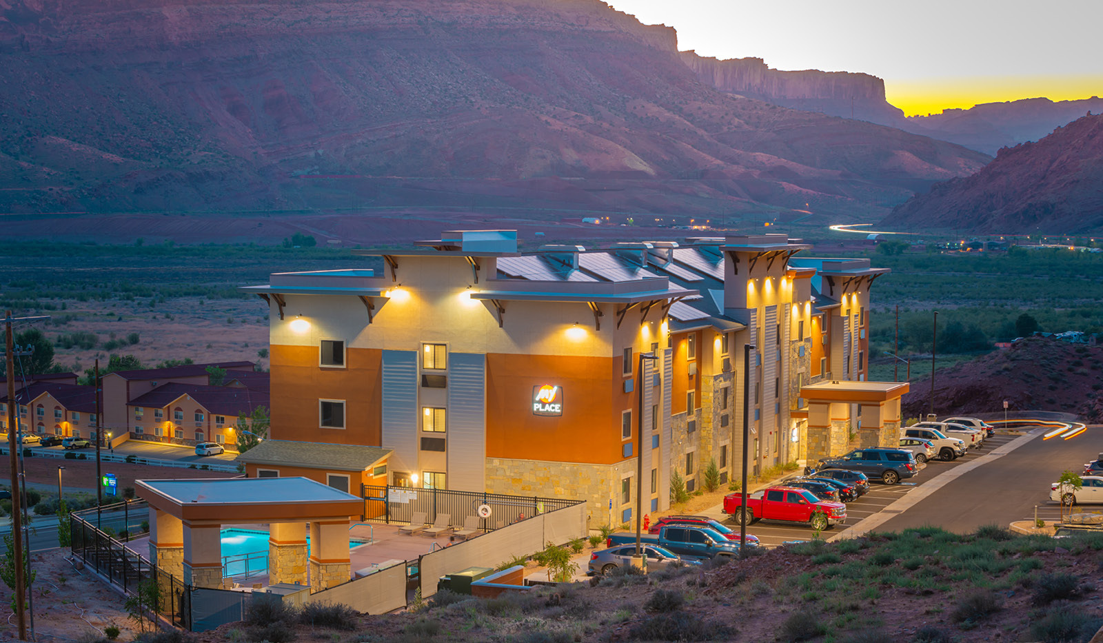 Exterior My Place Hotel-Moab, UT illuminated at night.
