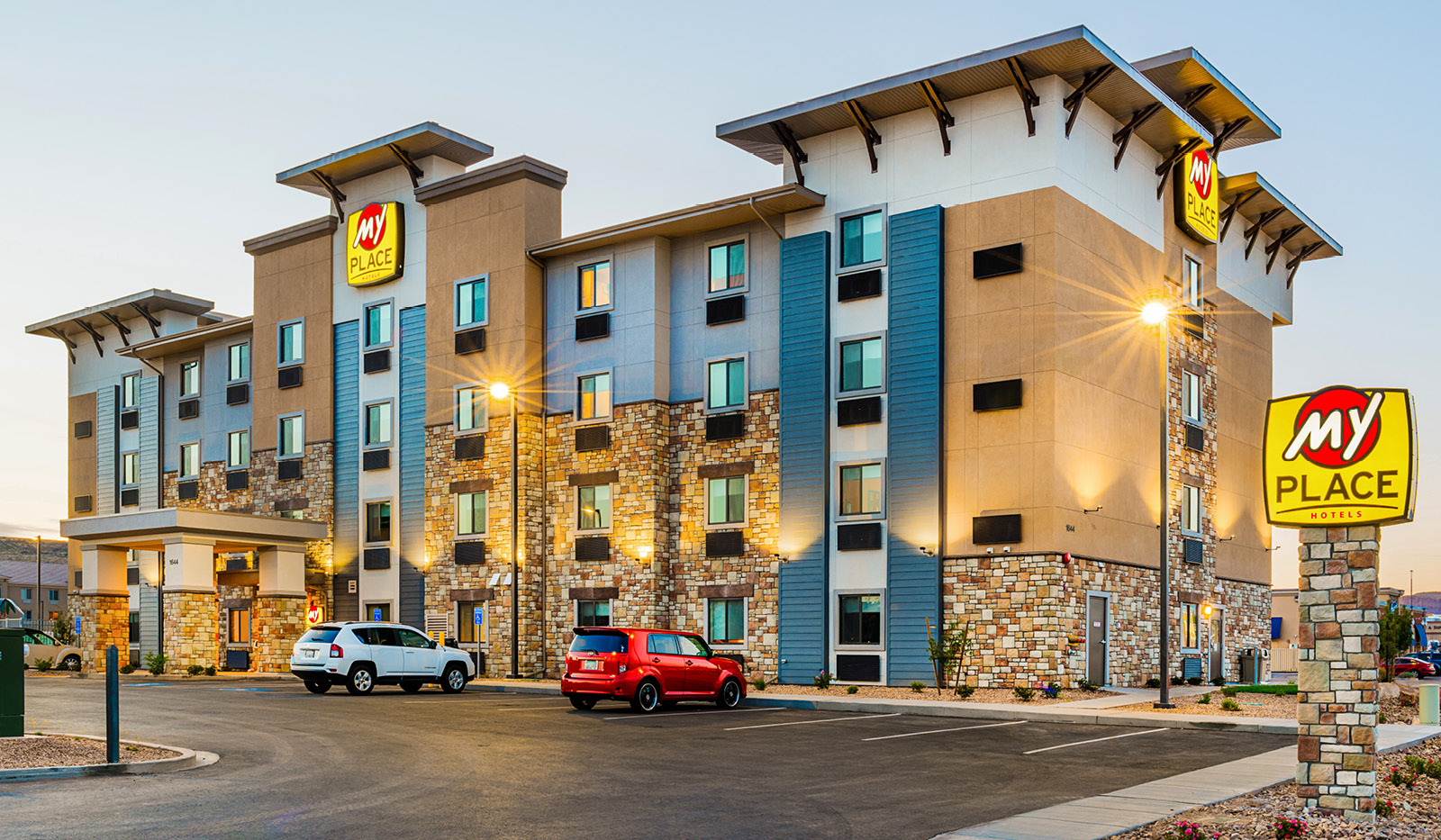 Exterior My Place Hotel-St. George, UT illuminated at dusk.