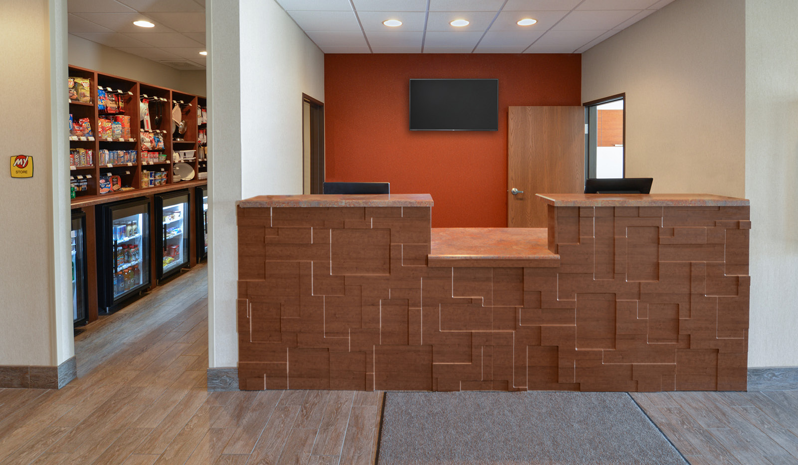 Entrance of hotel. Front desk with My Store to the left.