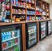 Rows of snacks and toiletries sit above coolers of drinks at the My Store in the lobby at My Place Hotels.