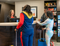 Three people checking into a My Place.