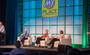 Panelists in chairs under a My Place logo.