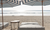 Beach bed and umbrellas on the beach.