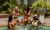 Group of women sitting in a pool with drinks.