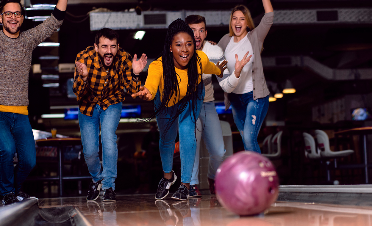 A group of people out bowling.
