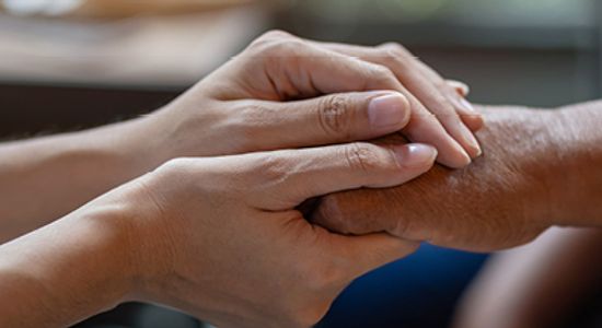 Hands holding each other.