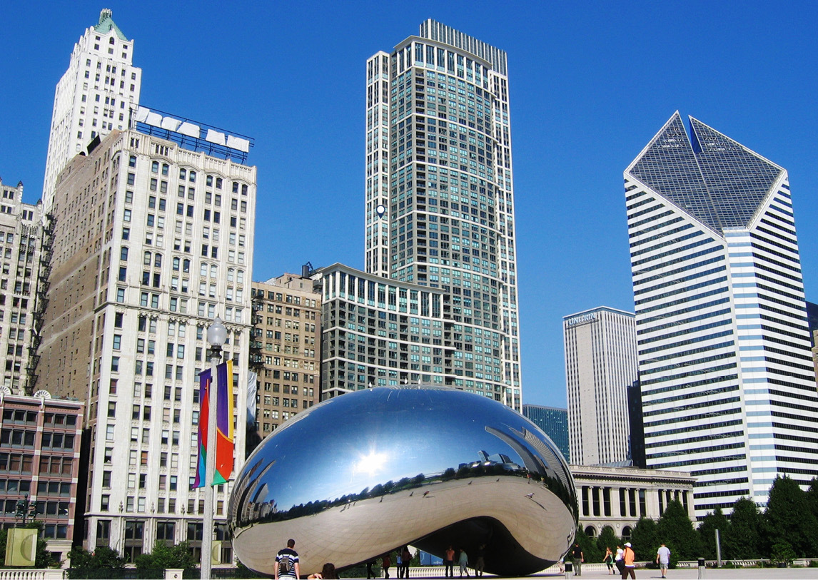 A tall Chicago cityscape sets behind the Cloud Gate sculpture, also known as The Bean.