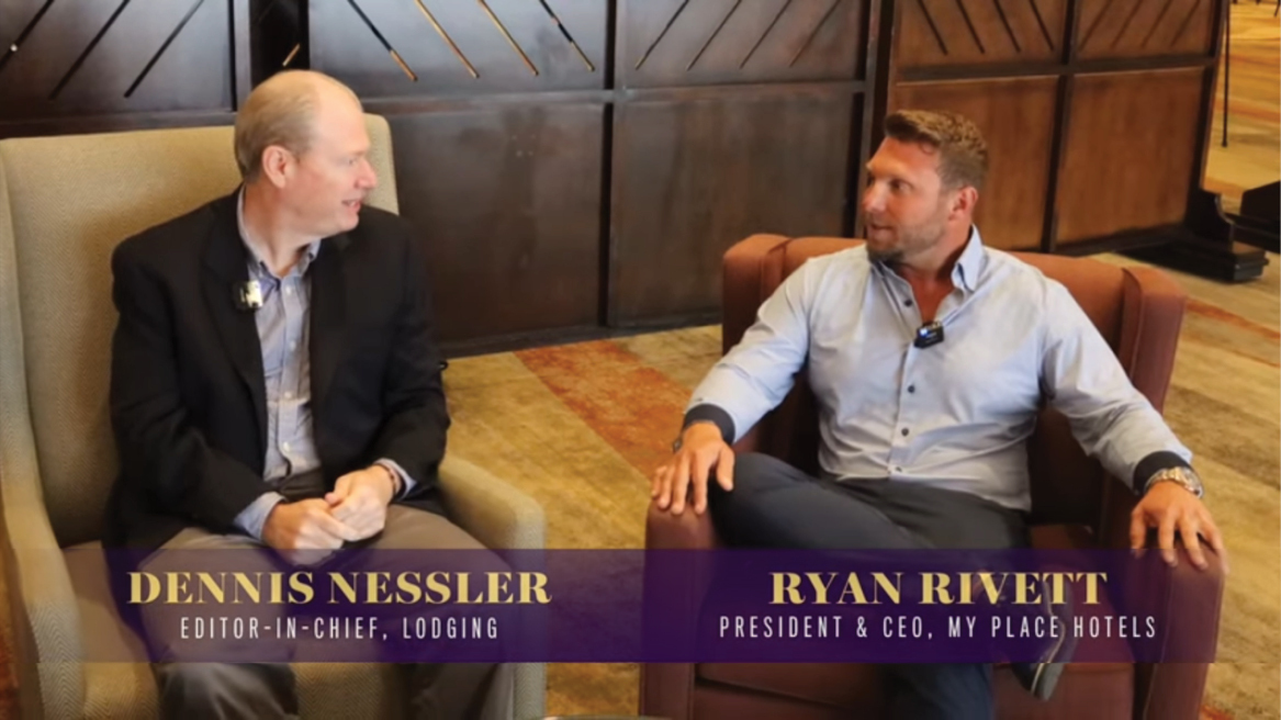 Ryan in a hotel lobby being interviewed by Dennis Nessler Editor in Chief of Lodging on Demand.