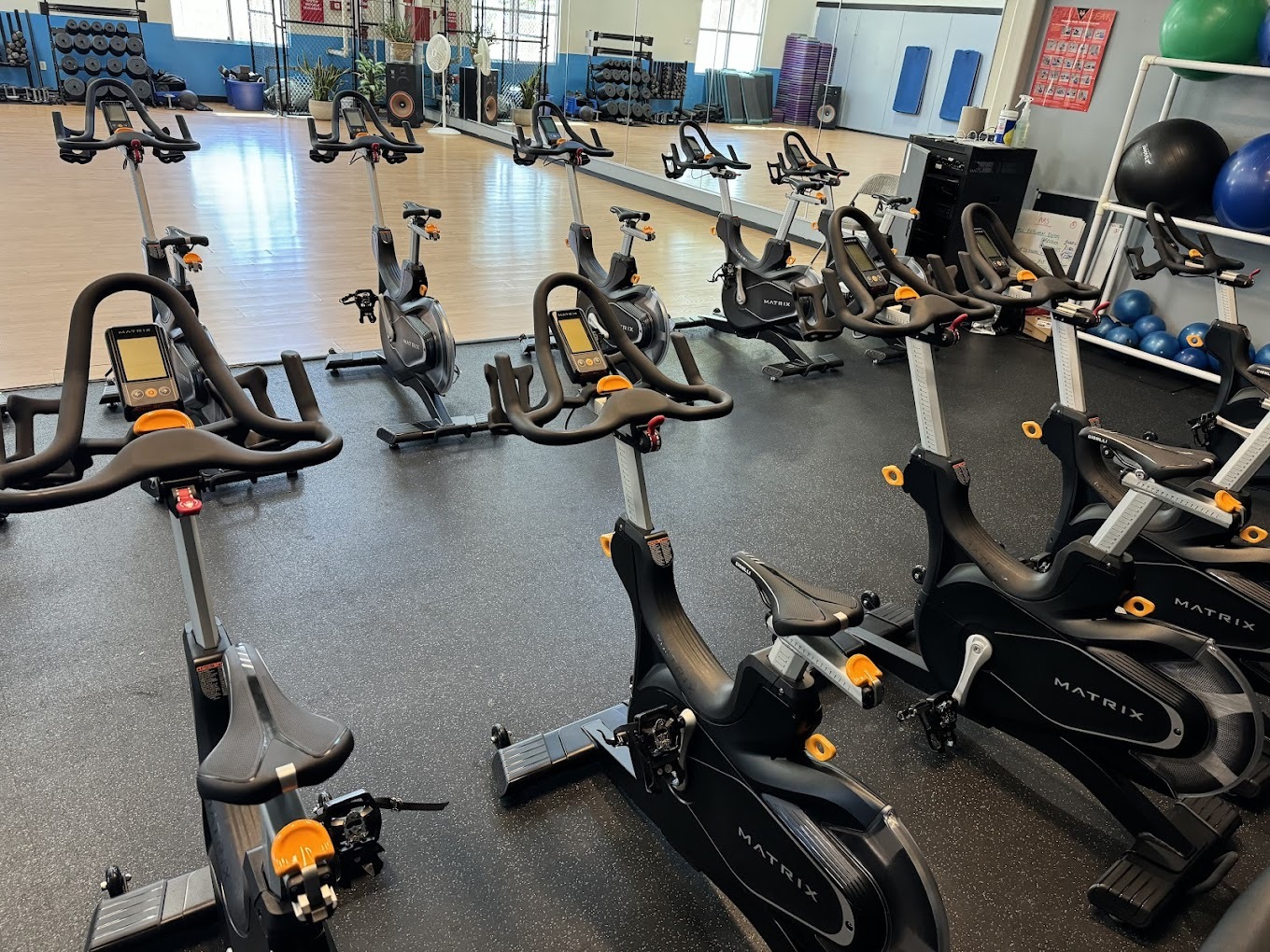 A smaller room filled with different kinds of cardio equipment.