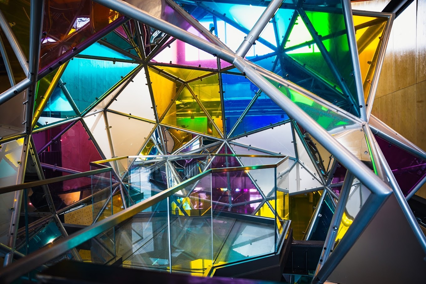 A view of a colorful glass sculpture close-up and from the side.