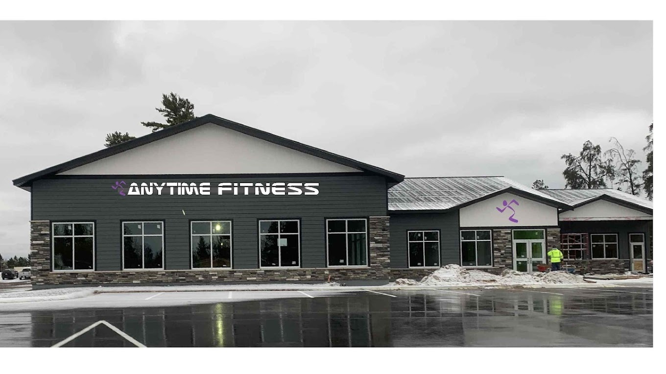 An outside view of an gym, lots of windows with "Anytime Fitness" in white lettering above the windows in the front.
